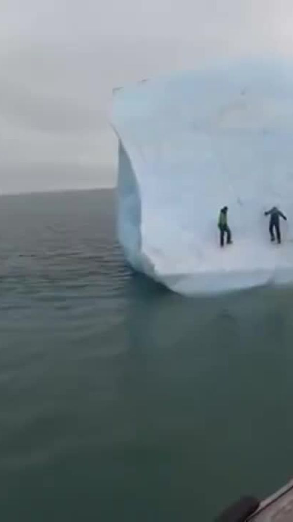 Massive iceberg flips over